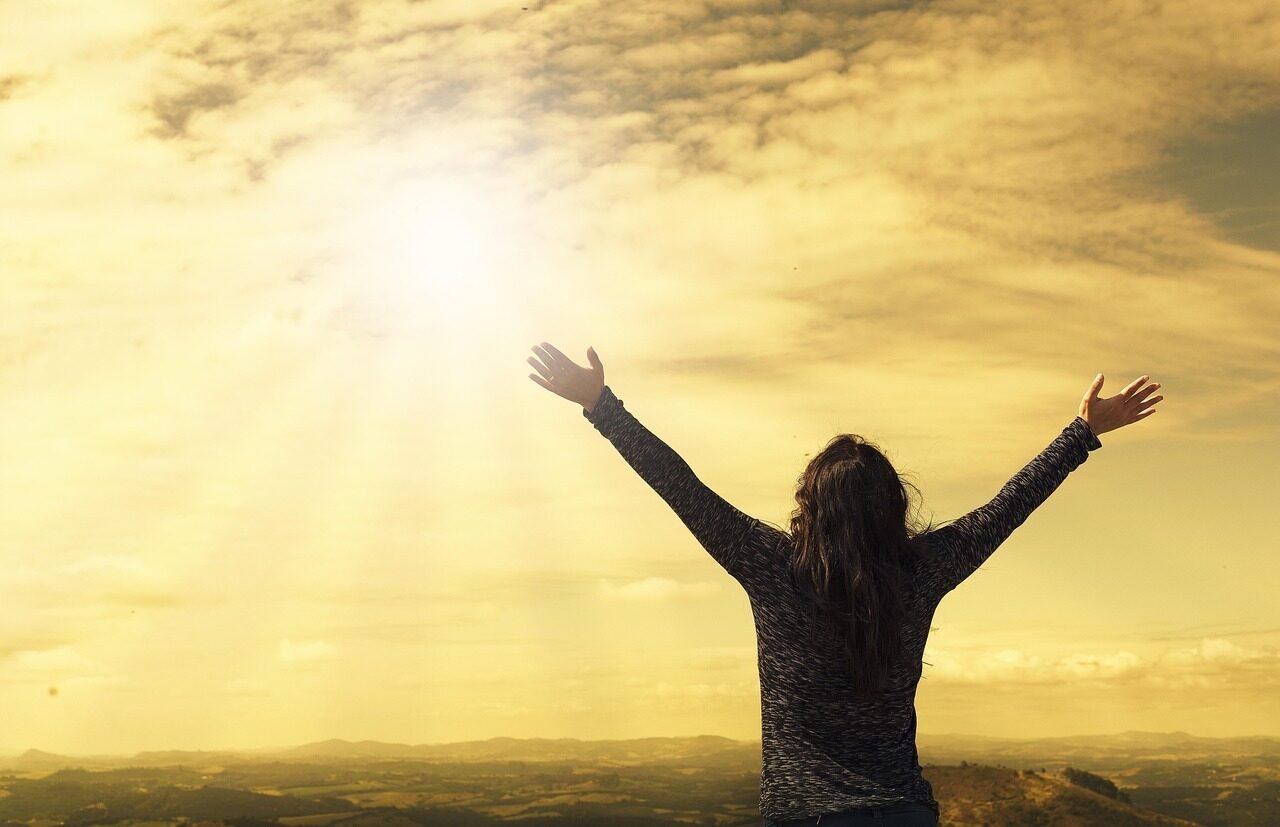 woman, sky, sunlight, arms, open arms, sunbeams, sunrays, clouds, worship, nature, freedom, happiness, relieved, prayer, praise, success, joy